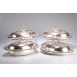 ^ A SET OF FOUR SILVER-PLATED ENTREE DISHES AND COVERS, oval with beaded borders, each engraved with