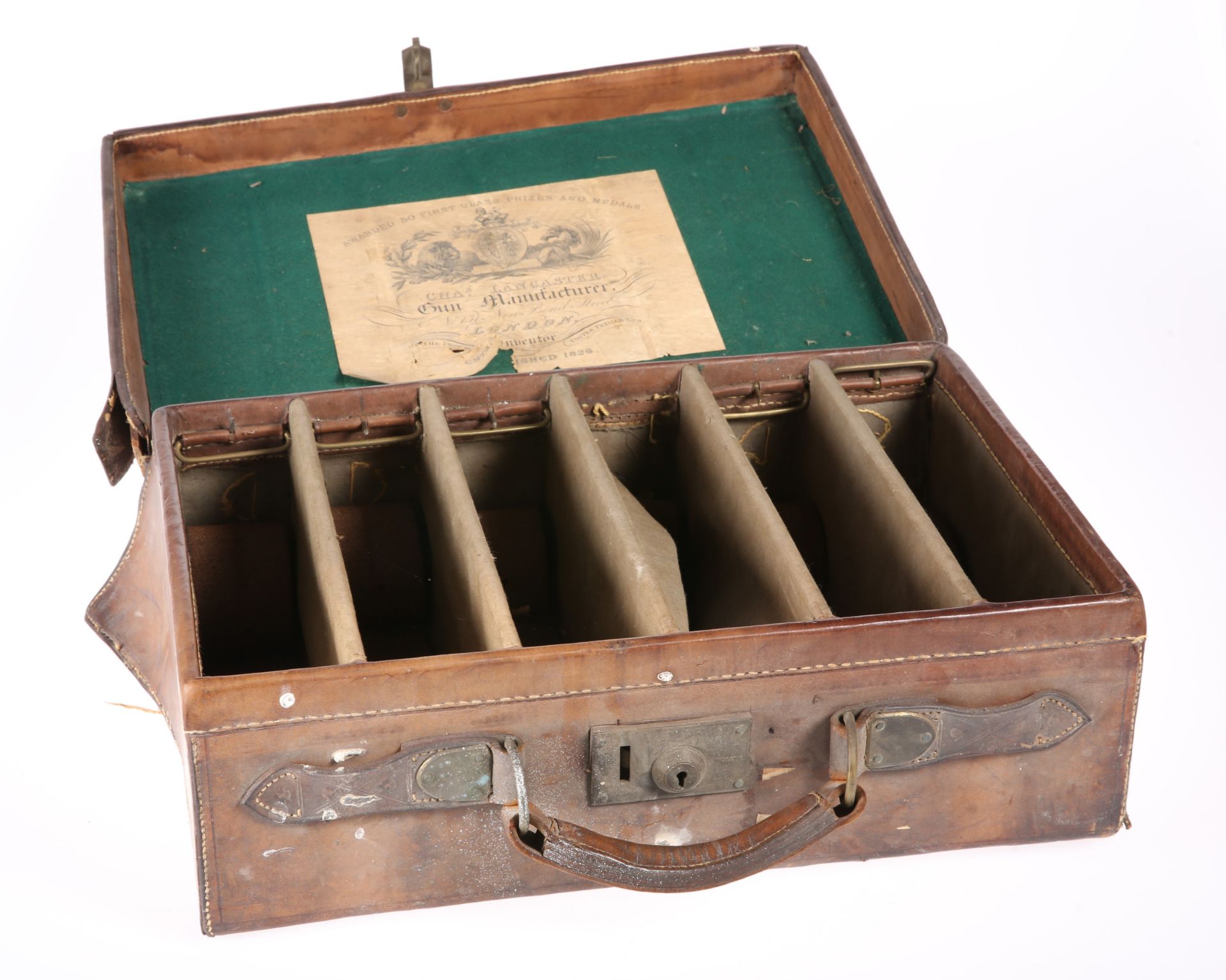 ~ A CHARLES LANCASTER LEATHER-BOUND CARTRIDGE CASE, with five fixed canvas dividers, trade label