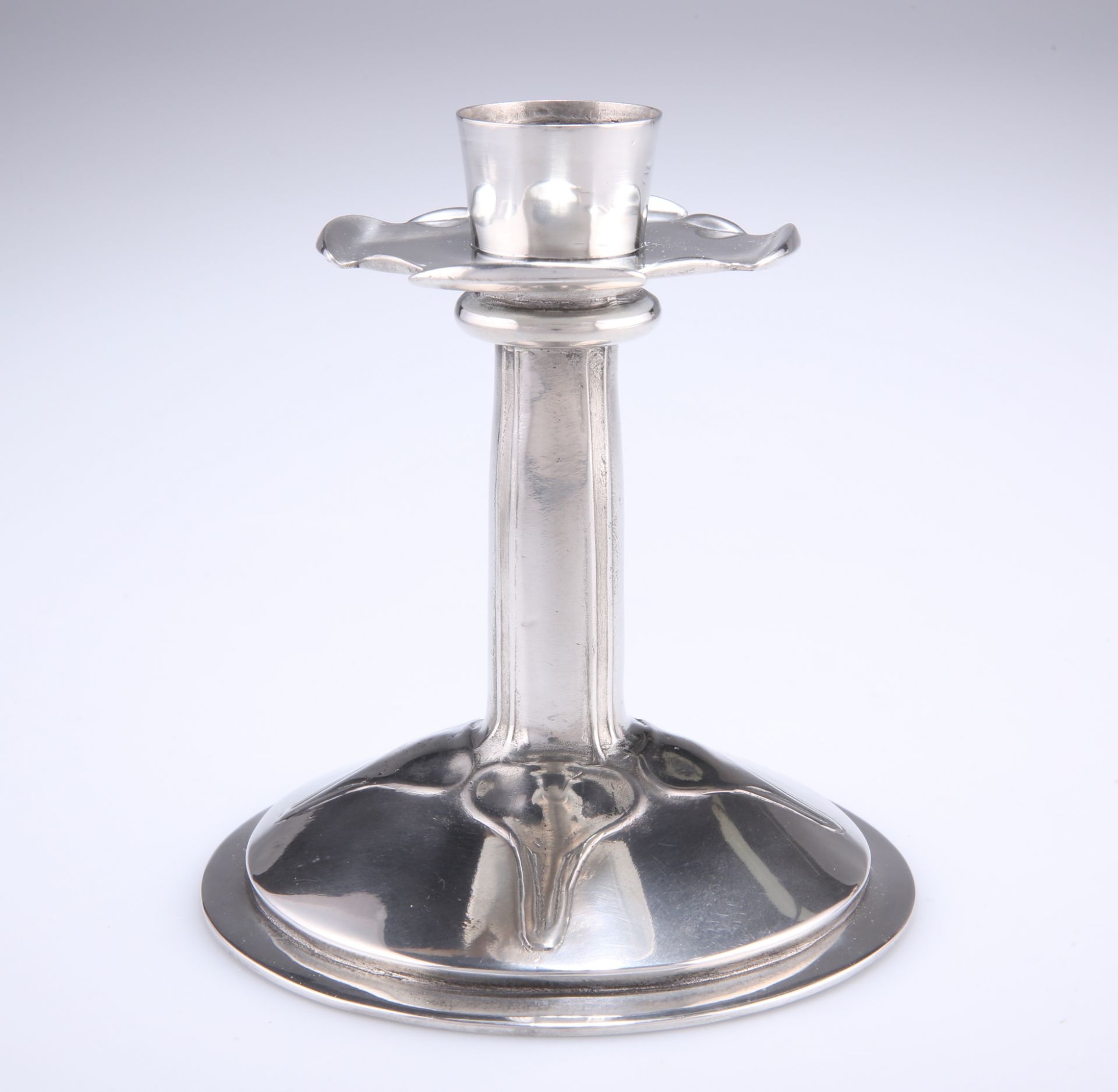 ARCHIBALD KNOX (1864-1933) A LIBERTY & CO TUDRIC PEWTER CANDLESTICK, NO.023, of squat form with