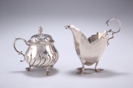 A LATE VICTORIAN SILVER CREAM JUG, by George Nathan & Ridley Hayes, Chester 1897, of faceted