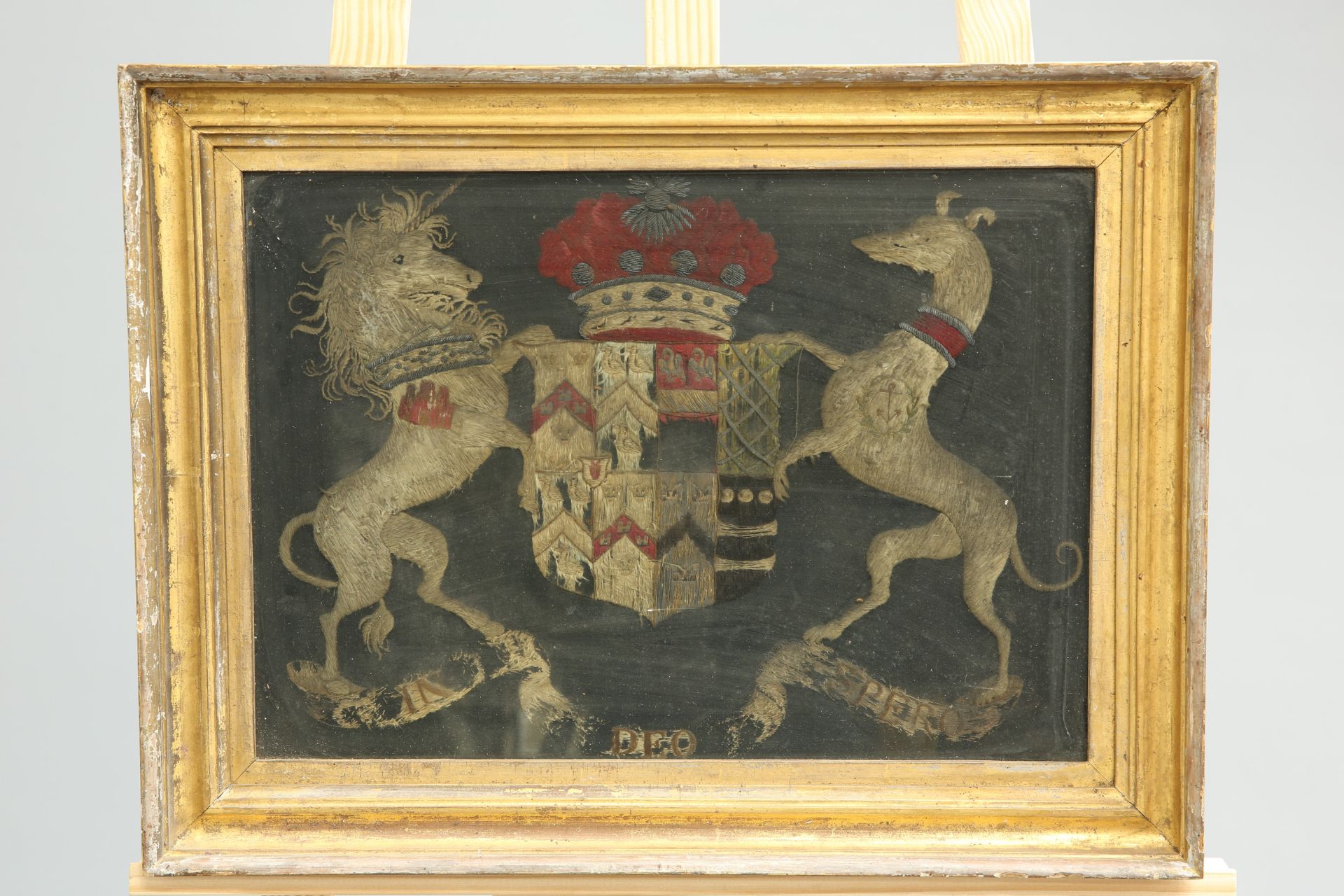 ~ AN 18TH CENTURY STUMPWORK COAT OF ARMS FOR LORD DE SAUMAREZ OF GUERNSEY, framed. Overall 38cm by