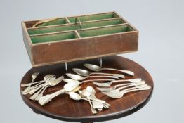 ~ A GEORGIAN OAK CUTLERY TRAY, containing silver flatware, various marks but each engraved with