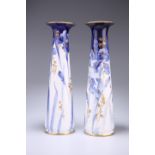 A PAIR OF DOULTON BURSLEM BLUE AND WHITE VASES, of tapering cylindrical form, each painted and