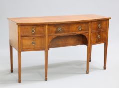 A REGENCY STYLE MAHOGANY BOWFRONTED SIDEBOARD, fitted with an arrangement of drawers and cupboard