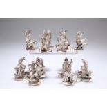 ^ A SET OF FOUR INDIAN WHITE METAL TABLE STANDS, CIRCA 1880, each triform base supporting three