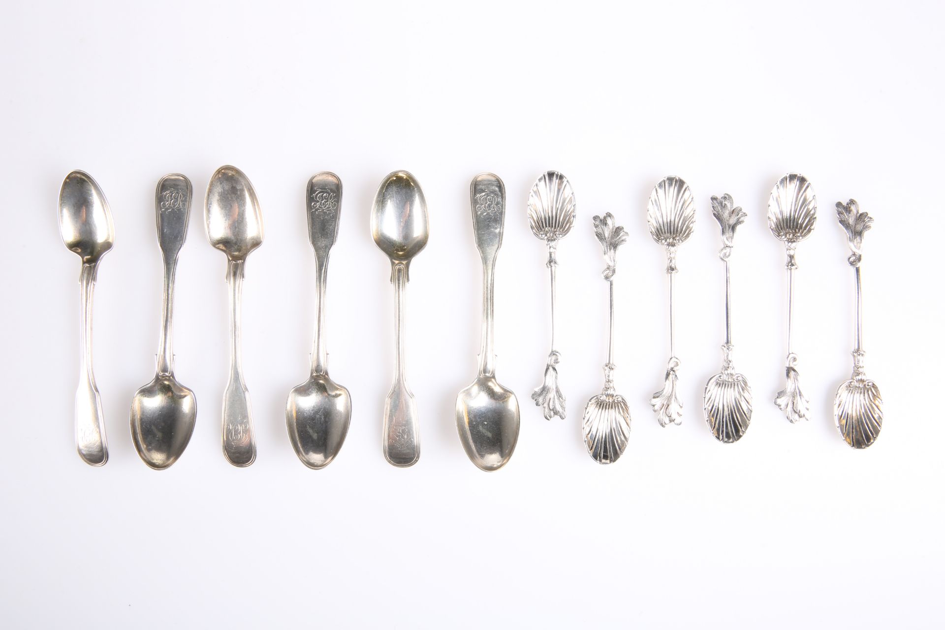 A SUITE OF SIX VICTORIAN SILVER TEASPOONS, by John Henry Williamson, London 1880, with scallop shell
