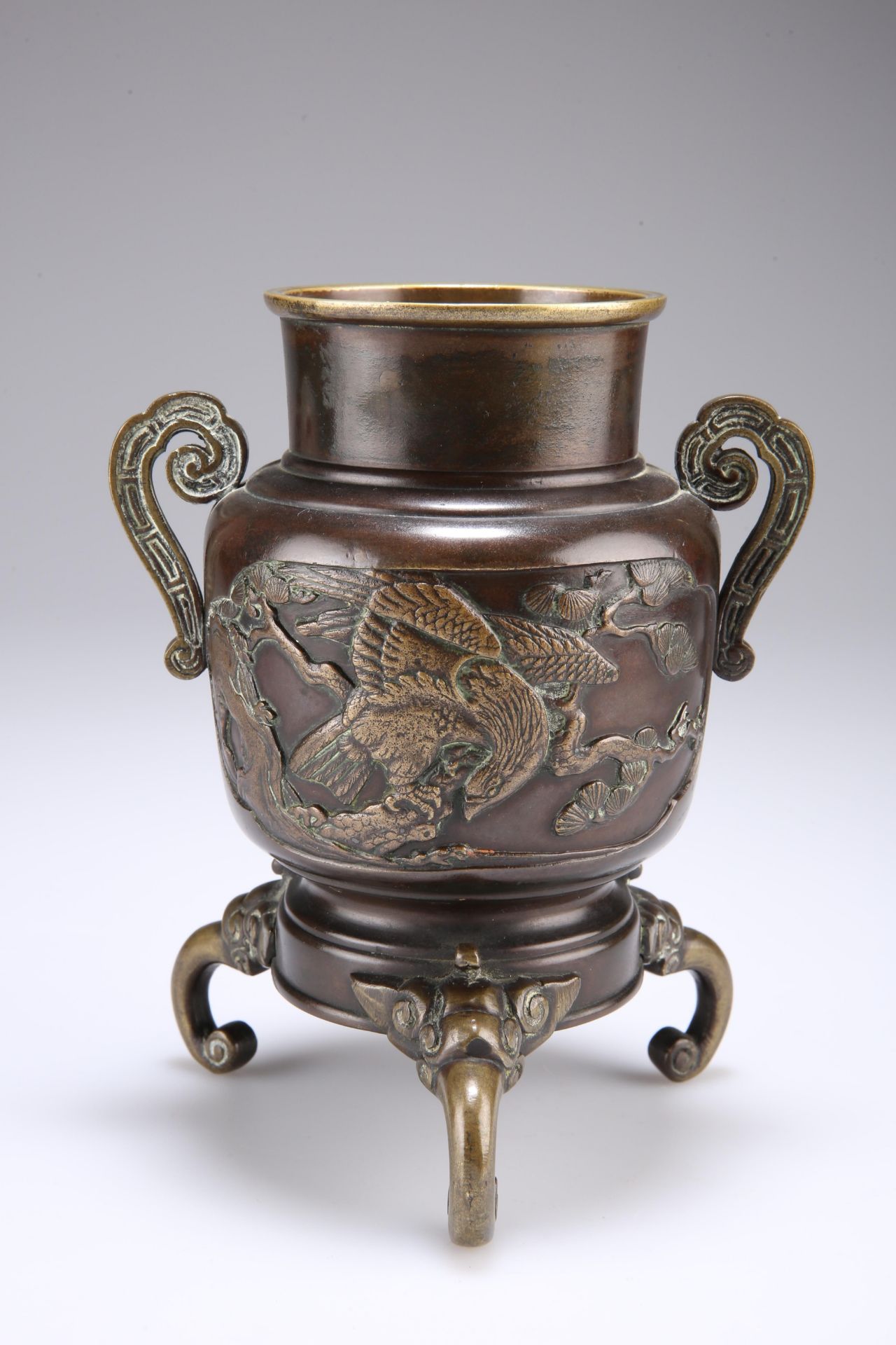 A JAPANESE BRONZE INCENSE BURNER, 19TH CENTURY, cast with opposing panels of birds, raised on a