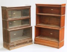 TWO GLOBE WERNICKE BOOKCASES, the first oak, with three glazed sections and base drawer, the