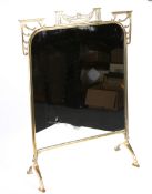 AN EARLY 20TH CENTURY BRASS MIRRORED FIRESCREEN. 67.5cm high