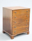 A GEORGIAN STYLE MAHOGANY CHEST OF DRAWERS, the moulded rectangular top over five drawers with brass