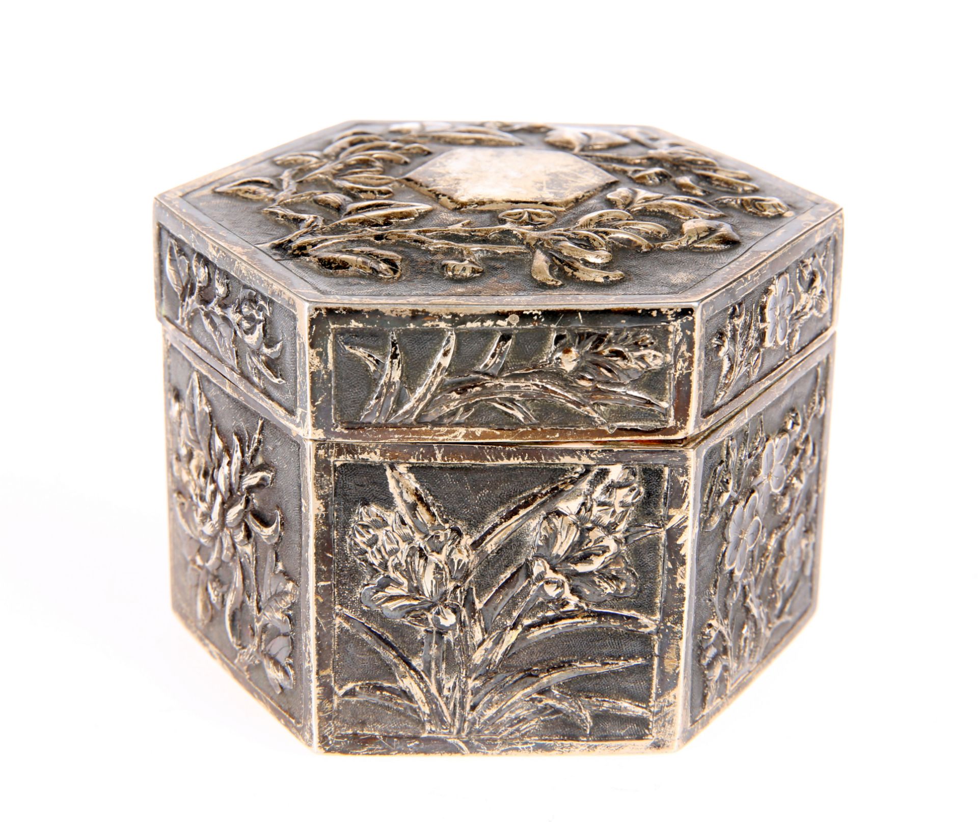 A CHINESE SILVER BOX AND COVER, CANTON, CIRCA 1880, octagonal, decorated in relied with foliage,