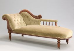 A VICTORIAN MAHOGANY CHAISE LONGUE, with scroll-carved back frame and four-spindle gallery, raised