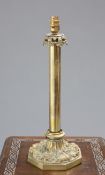 A BRASS COLUMNAR TABLE LAMP, 19TH CENTURY, with boldly cast octagonal base.