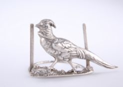 AN EDWARDIAN SILVER MENU HOLDER IN THE FORM OF A PHEASANT, by Charlie Jacques & Frederick