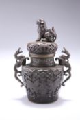 A BRONZE KORO AND COVER, shouldered baluster form, moulded with shishi and moths, with dragon scroll