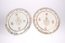A PAIR OF PORCELAIN PLATES IN THE CHINESE EXPORT ARMORIAL STYLE, each enamel painted with a floral