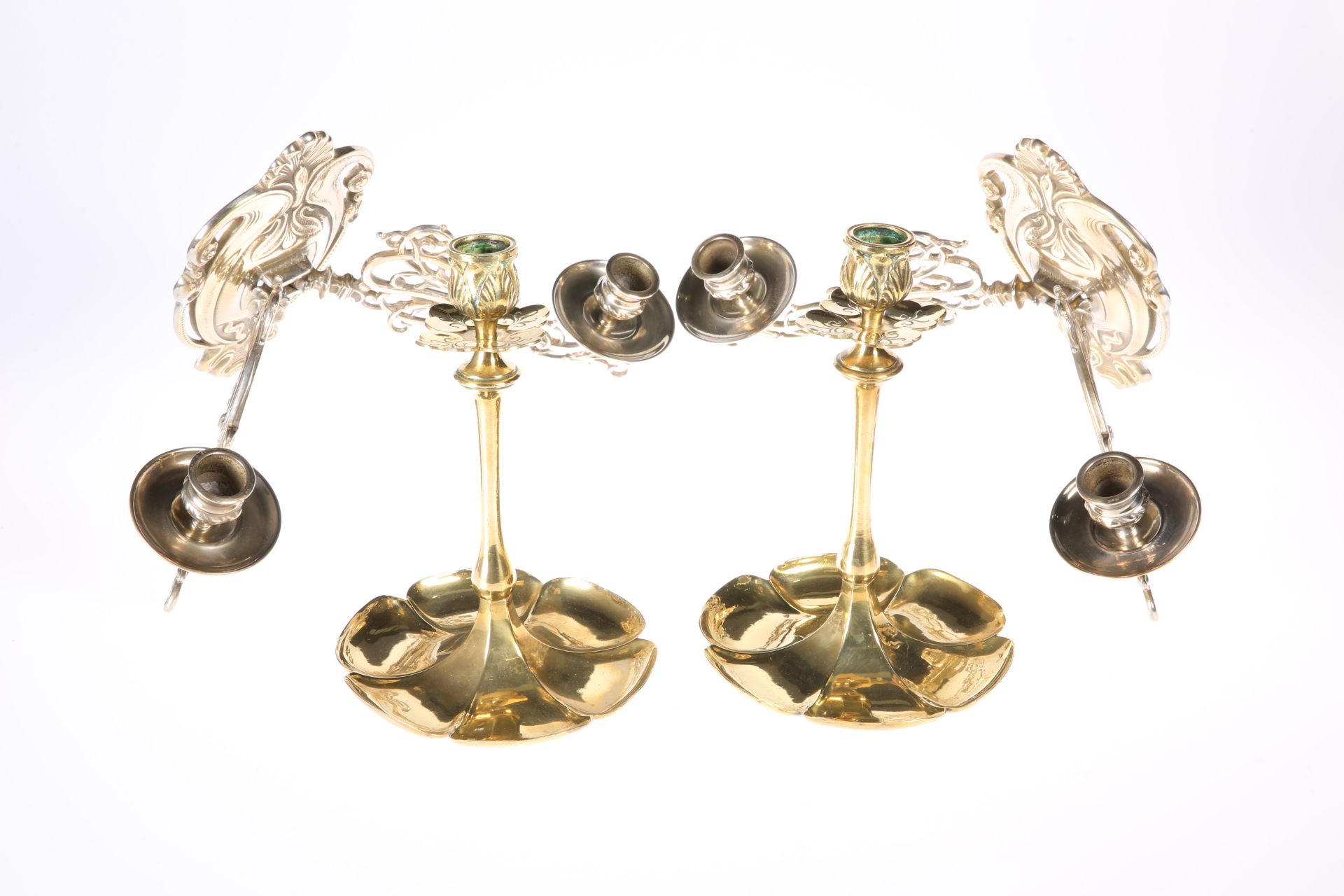 A PAIR OF LATE VICTORIAN BRASS CANDLESTICKS, each with lobed base; together with A PAIR OF ART