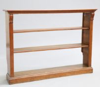 A MID 19TH CENTURY OAK BOOKCASE, possibly by Gillows, open-backed with scrolling corbels to the