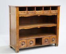 A CONTINENTAL OAK DRESSER, CIRCA 1900, the rectangular top above five drawers with leaf-carved