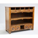 A CONTINENTAL OAK DRESSER, CIRCA 1900, the rectangular top above five drawers with leaf-carved