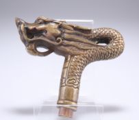 A CHINESE BRASS CANE HANDLE, in the form of a dragon's head. 12cm front to back
