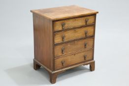 A GEORGE III MAHOGANY CHEST OF DRAWERS, of small proportions, the crossbanded rectangular top over