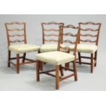 A SET OF FOUR GEORGE III MAHOGANY DINING CHAIRS, each with open wavy ladderback.