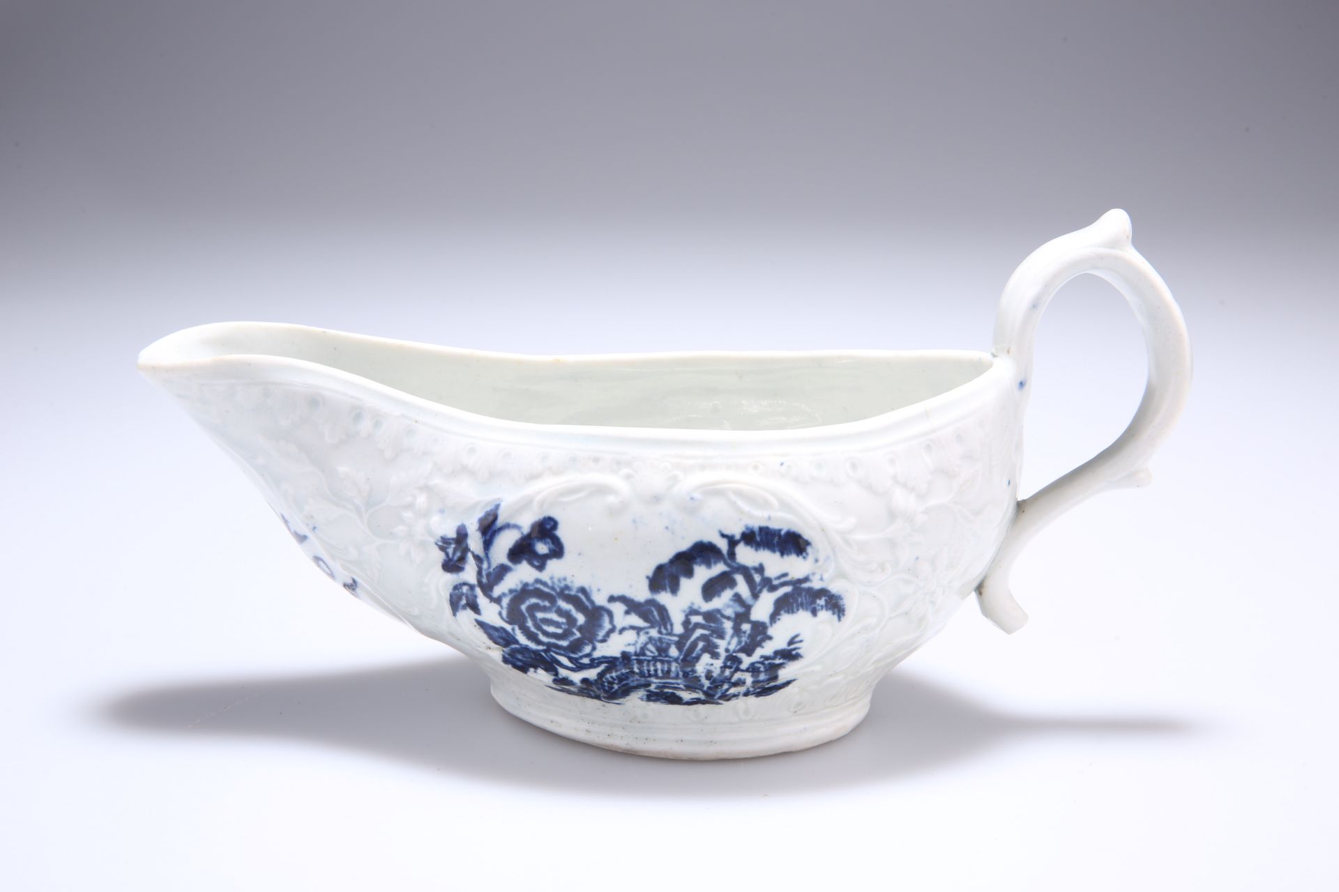 A SETH PENNINGTON LIVERPOOL MOULDED SAUCE BOAT, CIRCA 1785-90, blue printed with the Peony and Fence
