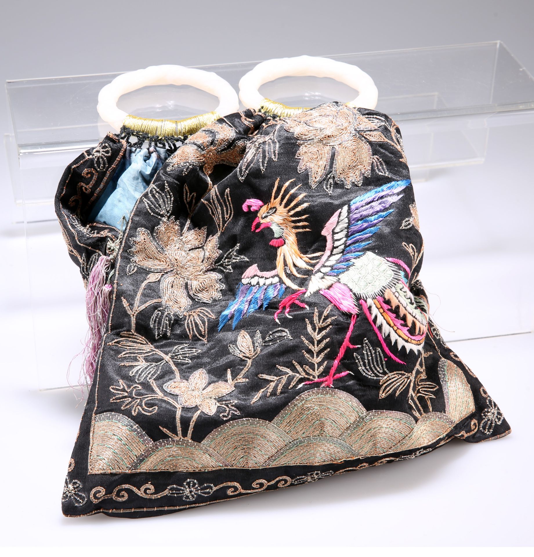 A CHINESE SILK HANDBAG, WITH CARVED JADE HANDLES, embroidered with hoho bird amongst foliage, to the