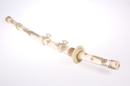 A JAPANESE BONE SWORD, CIRCA 1900, with engraved and stained decoration, 17-inch bone blade. 80cm