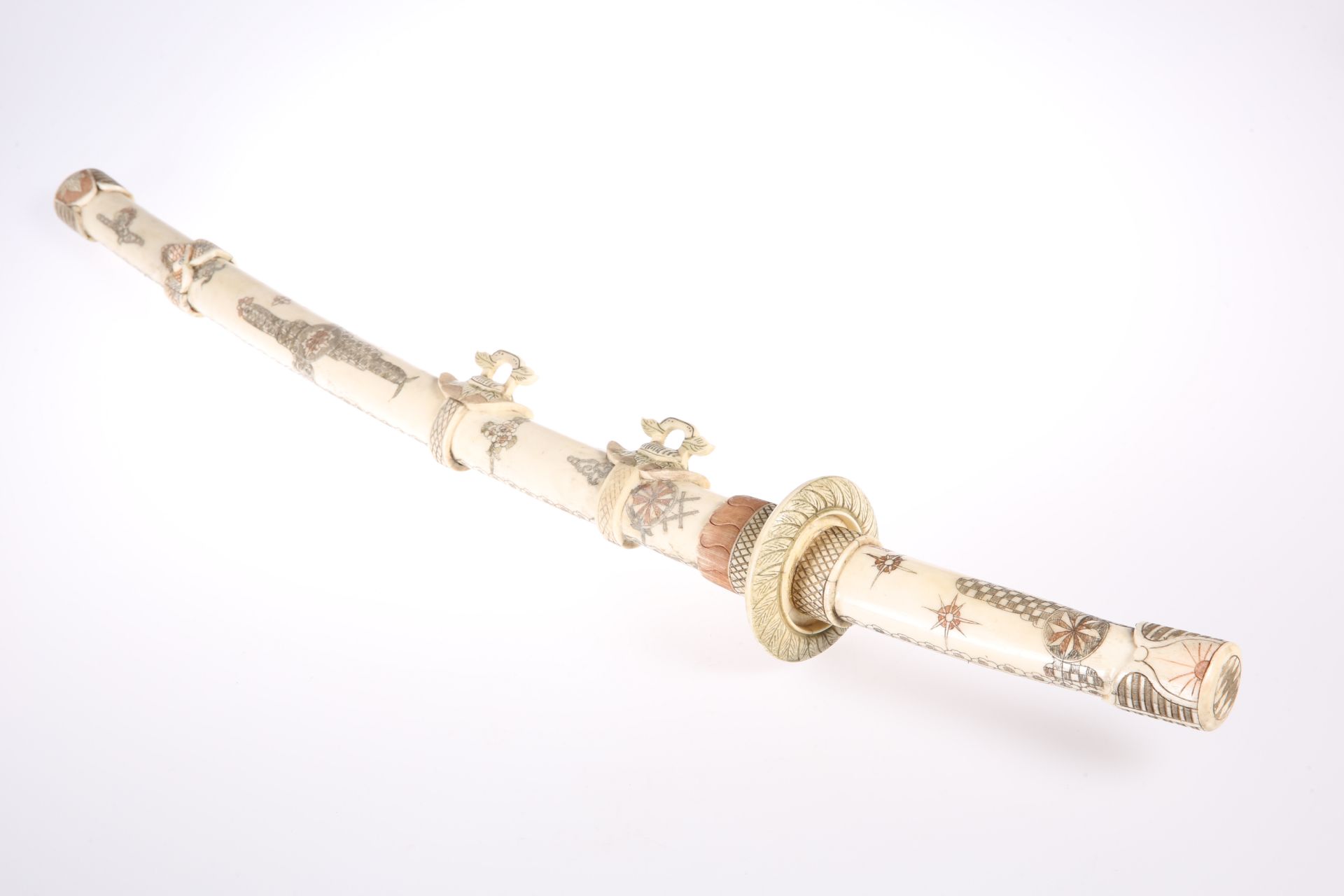 A JAPANESE BONE SWORD, CIRCA 1900, with engraved and stained decoration, 17-inch bone blade. 80cm