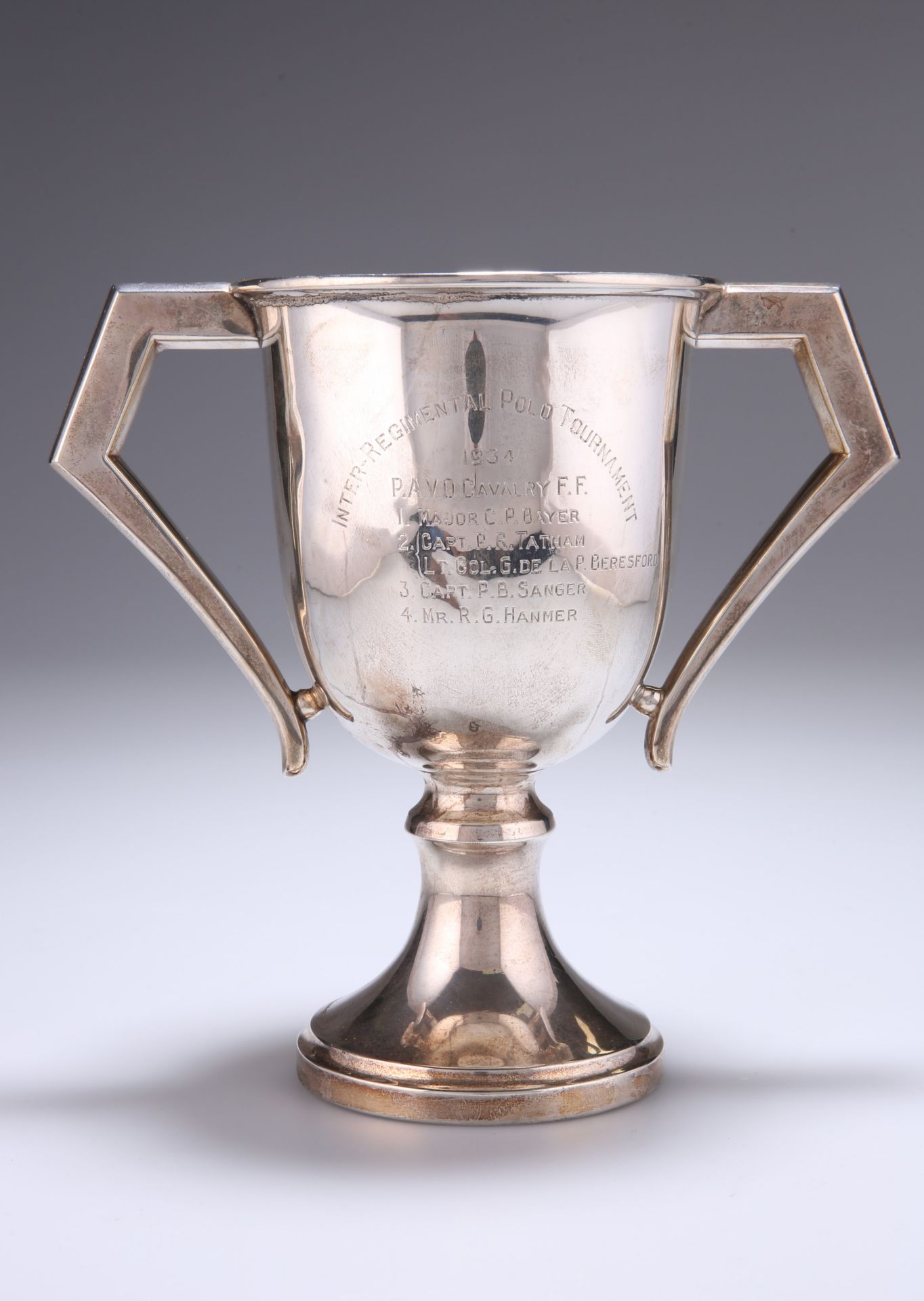 ^ A GEORGE V SILVER TWO-HANDLED TROPHY CUP, by Hamilton & Co (of Calcutta), London 1932, with