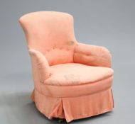 ~ A VICTORIAN COUNTRY HOUSE UPHOLSTERED ARMCHAIR, raised on turned forelegs and splayed rear legs,