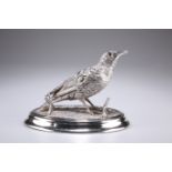 AN EDWARDIAN SILVER-PLATED NOVELTY INKWELL, in the form of a snipe, realistically cast standing on a