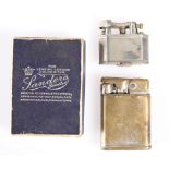 A RARE LADY'S CIGARETTE LIGHTER BY DUNHILL, the silver-plated body incorporating a shrouded guard