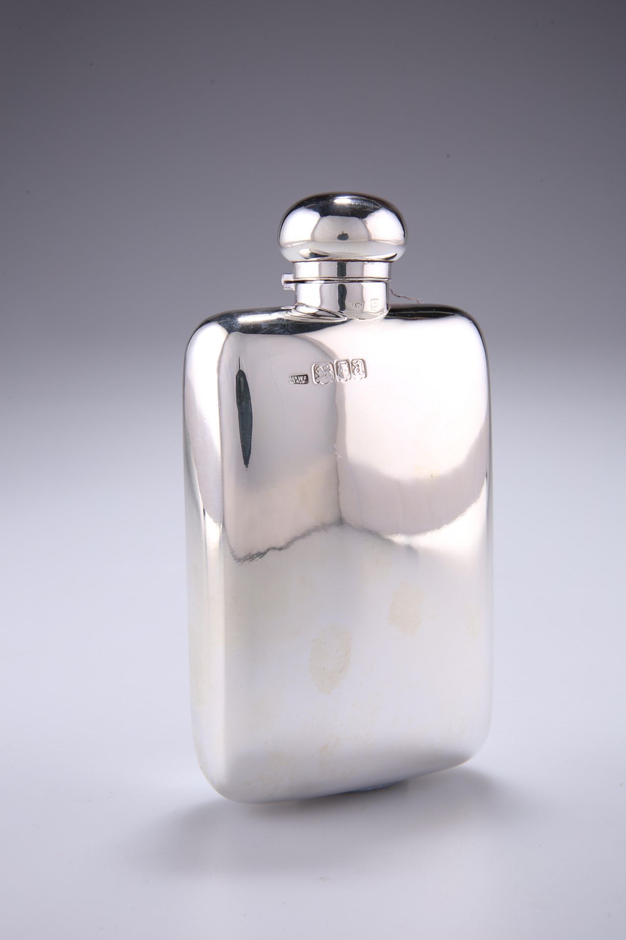 A GEORGE V SILVER HIP FLASK, by Mappin & Webb Ltd, London 1916, with twist domed cap and rounded