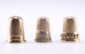 A 15 CARAT GOLD THIMBLE, by John William Kirwan, Chester, date letter rubbed; together with