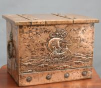 AN ARTS AND CRAFTS COPPER COAL BOX, rectangular with hinged lid, the front repousse with a