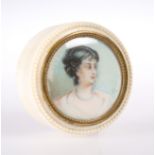 A 19TH CENTURY IVORY TRINKET BOX, circular, the cover inset with a portrait miniature of a lady,