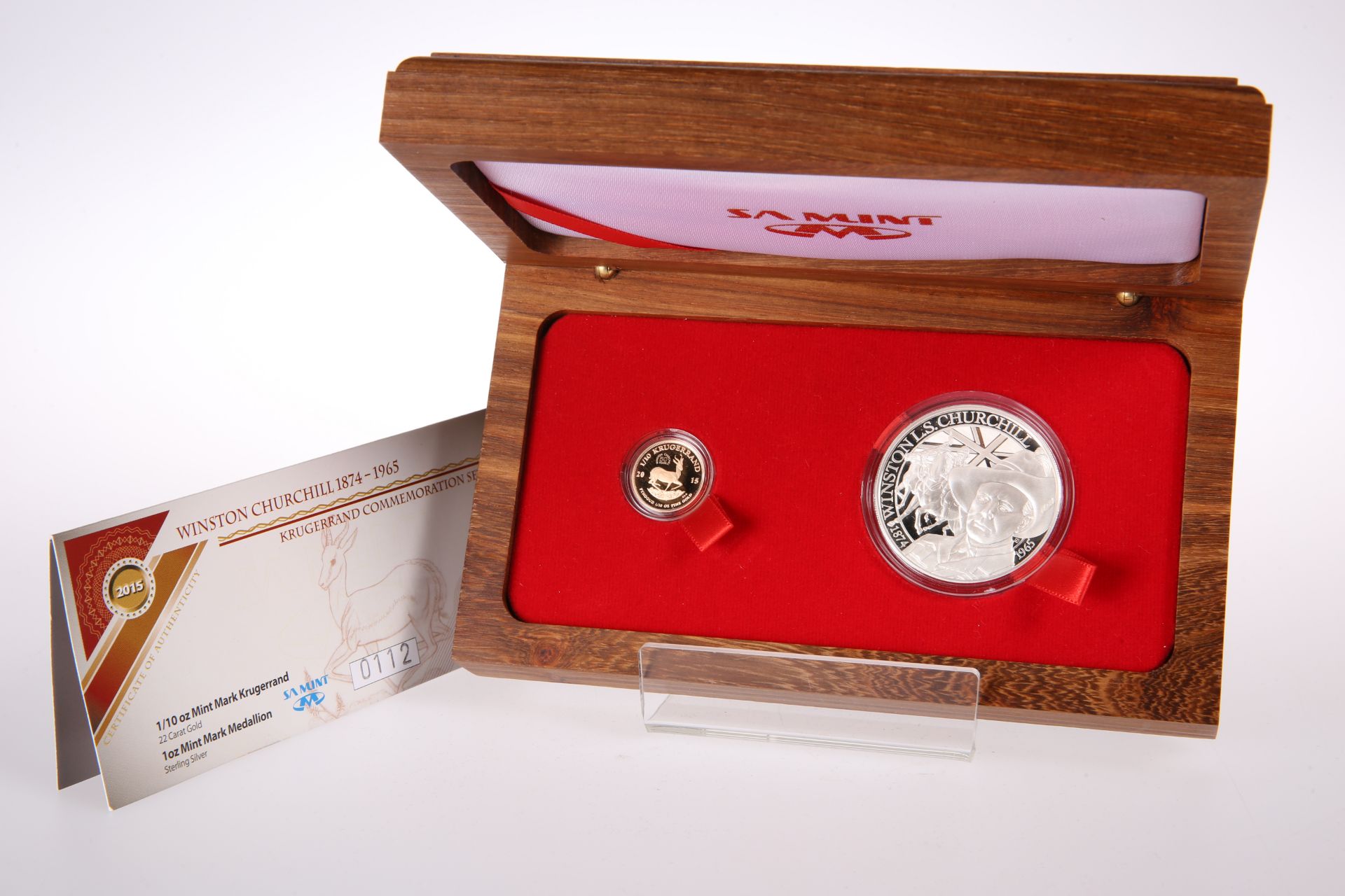 A 2015 WINSTON CHURCHILL TWO COIN KRUGERRAND COMMEMORATIVE SET, comprising 1/10oz 22 carat gold