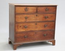 A GEORGE III MAHOGANY CHEST OF DRAWERS, the moulded rectangular top above two short over three