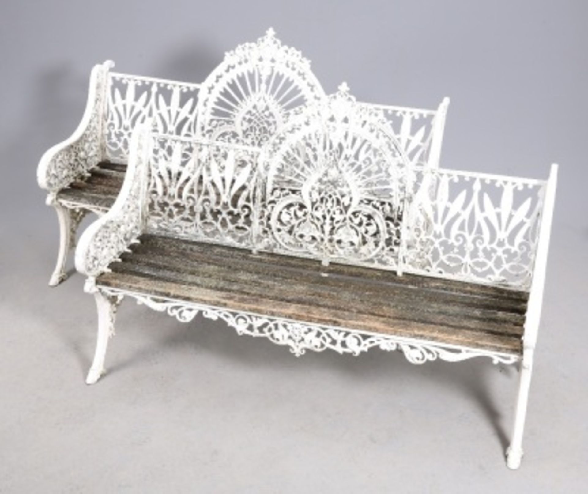 A PAIR OF PAINTED METAL GARDEN BENCHES, IN COALBROOKDALE STYLE. 152cm long