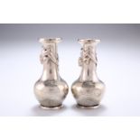 ^ A PAIR OF CHINESE WHITE METAL PEPPER POTS, each engraved with Emsdorf, Waterloo and Villers-En-