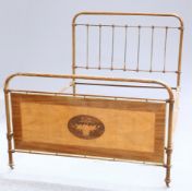 A PAINTED IRON AND MARQUETRY DOUBLE BED, C.1900, the footboard inlaid with a basket of flowers.