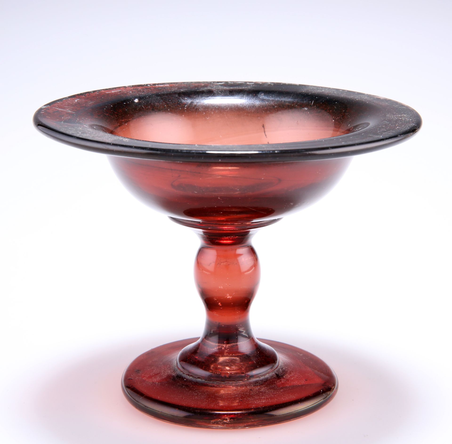 AN 18TH CENTURY GLASS TAZZA, APPARENTLY HULL GLASS, with baluster stem and plain circular foot,