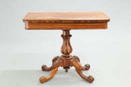 A VICTORIAN ROSEWOOD FOLDOVER CARD TABLE, the moulded rectangular top with rounded corners, raised