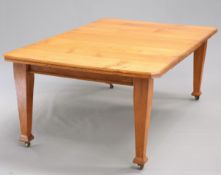 AN OAK WIND-OUT EXTENDING DINING TABLE, CIRCA 1900
