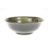 A CHINESE SPINACH JADE BOWL, 19th/20th Century, circular, bears engraved script marks to base.12.5cm