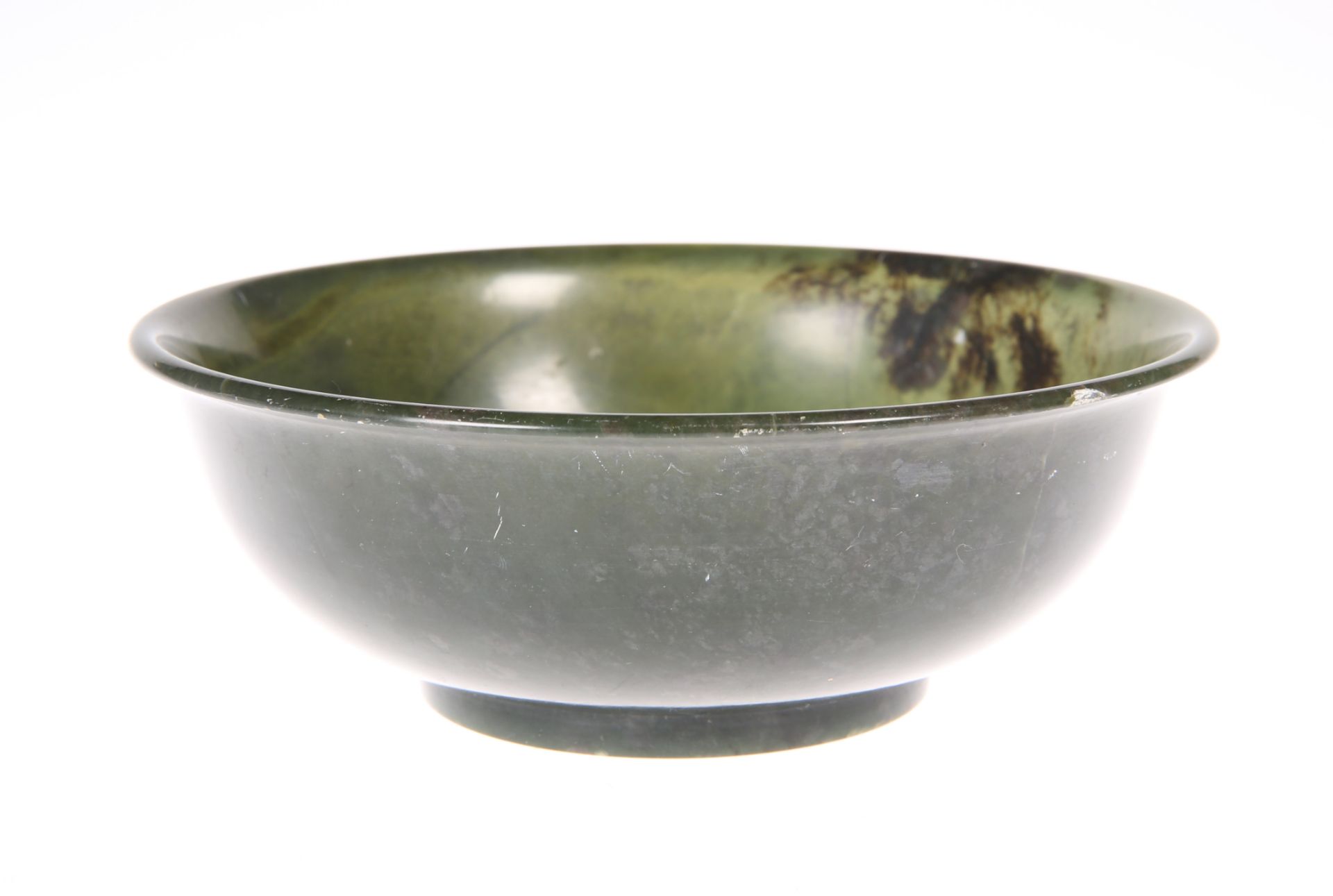 A CHINESE SPINACH JADE BOWL, 19th/20th Century, circular, bears engraved script marks to base.12.5cm