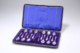 AN EDWARD VII CASED SET OF TWELVE SILVER COFFEE SPOONS AND SUGAR TONGS, by Lee & Wigfull (Henry